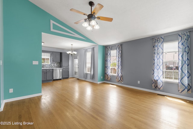 267 Stellar Dr, Shepherdsville, KY 40165 - unfurnished living room with a chandelier, ceiling fan, light wood-style flooring, baseboards, and plenty of natural light