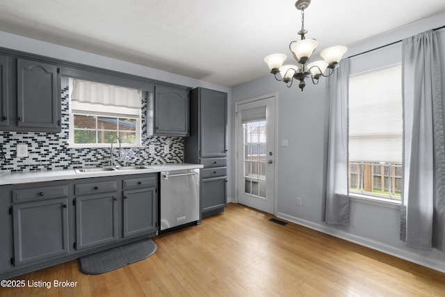 267 Stellar Dr, Shepherdsville, KY 40165 - kitchen featuring dishwasher, a sink, gray cabinetry, a chandelier, and light wood-style flooring