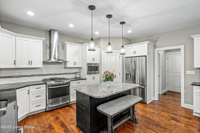 13412 Hampton Cir, Goshen, KY 40026 - kitchen featuring stainless steel appliances, wall chimney exhaust hood, white cabinets, hanging light fixtures, and recessed lighting