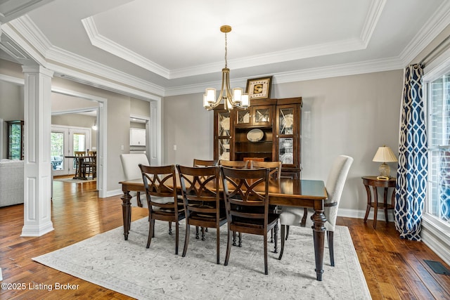 13412 Hampton Cir, Goshen, KY 40026 - dining room with hardwood / wood-style floors, crown molding, ornate columns, a chandelier, and baseboards