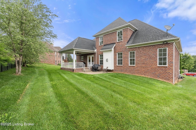 13412 Hampton Cir, Goshen, KY 40026 - rear view of house with a shingled roof, brick siding, ceiling fan, and a lawn