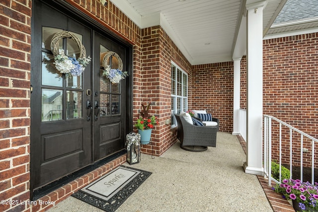 13412 Hampton Cir, Goshen, KY 40026 - doorway to property with brick siding, french doors, and covered porch