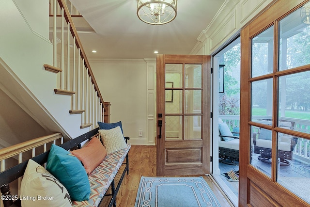 801 Shady Ln, Anchorage, KY 40223 - doorway to outside with ornamental molding, hardwood / wood-style flooring, a chandelier, stairway, and plenty of natural light