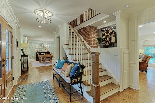 801 Shady Ln, Anchorage, KY 40223 - entrance foyer featuring a chandelier, stairs, crown molding, light wood-type flooring, and baseboards