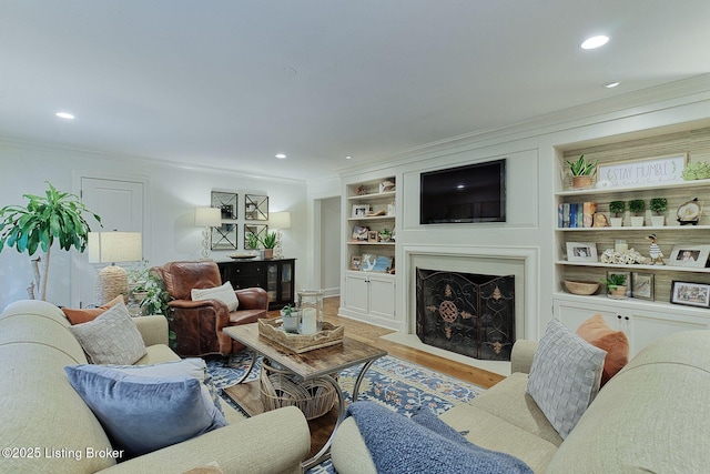 801 Shady Ln, Anchorage, KY 40223 - living area with ornamental molding, recessed lighting, wood finished floors, a fireplace with flush hearth, and built in features