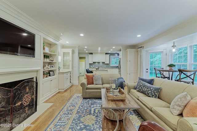 801 Shady Ln, Anchorage, KY 40223 - living room with crown molding, light wood finished floors, recessed lighting, and a fireplace with flush hearth