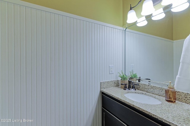801 Shady Ln, Anchorage, KY 40223 - bathroom featuring vanity, a chandelier, and a wainscoted wall