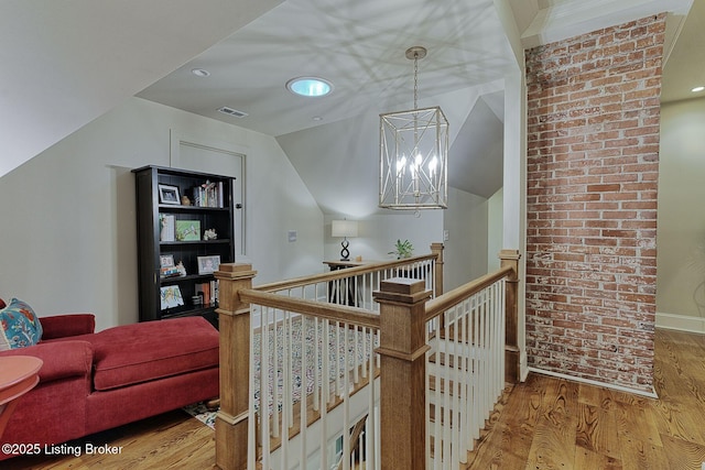 801 Shady Ln, Anchorage, KY 40223 - hall with an upstairs landing, wood finished floors, a chandelier, recessed lighting, and vaulted ceiling