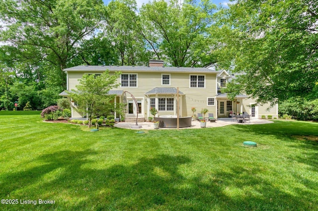 801 Shady Ln, Anchorage, KY 40223 - back of property featuring a patio area, a yard, entry steps, and a chimney