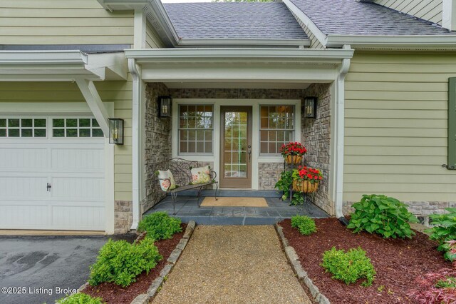 801 Shady Ln, Anchorage, KY 40223 - doorway to property with stone siding, roof with shingles, covered porch, and a garage
