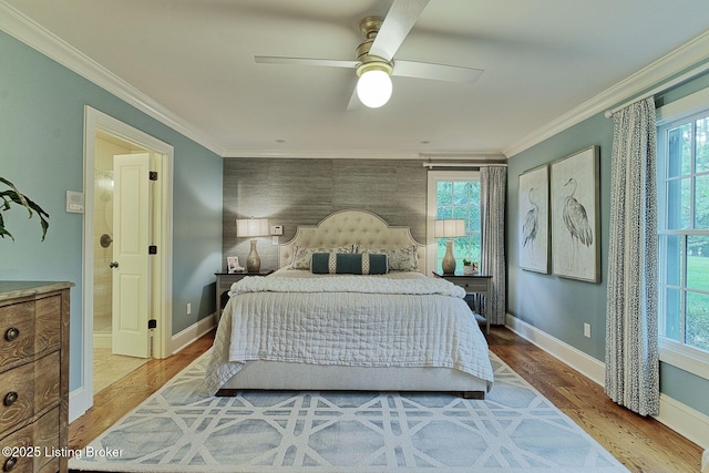 801 Shady Ln, Anchorage, KY 40223 - bedroom with multiple windows, baseboards, ornamental molding, light wood-style flooring, and an accent wall