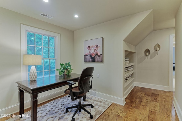 801 Shady Ln, Anchorage, KY 40223 - home office featuring wood finished floors, baseboards, recessed lighting, and built in shelves