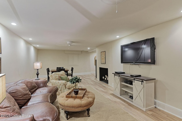 801 Shady Ln, Anchorage, KY 40223 - living area with light wood finished floors, recessed lighting, baseboards, and a fireplace