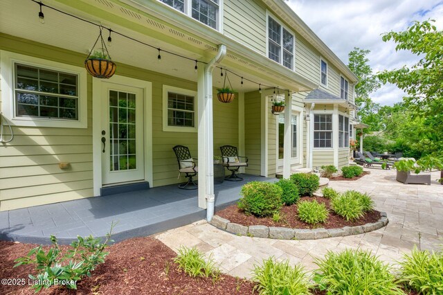 801 Shady Ln, Anchorage, KY 40223 - property entrance with a porch and a patio area