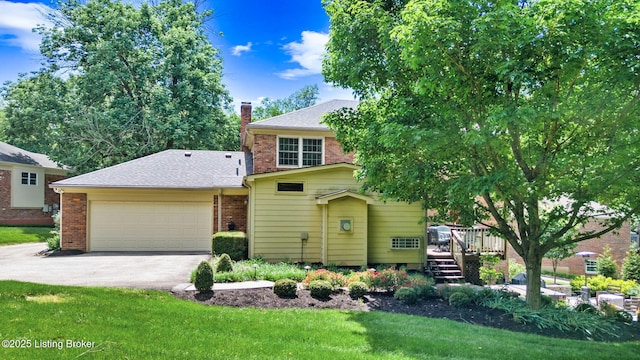 3711 Quail Hollow Ct, Louisville, KY 40241 - view of front of property featuring brick siding, driveway, a garage, a wooden deck, and a chimney