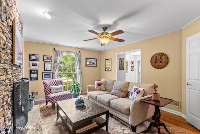 3711 Quail Hollow Ct, Louisville, KY 40241 - living room with wood finished floors, ceiling fan, crown molding, baseboards, and a decorative wall