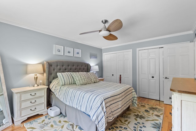 3711 Quail Hollow Ct, Louisville, KY 40241 - bedroom featuring multiple closets, ornamental molding, light wood-style flooring, and a ceiling fan