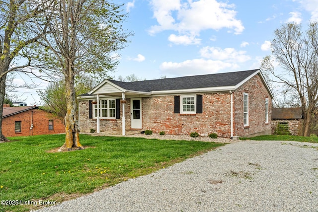 224 Murphy Ln, Bloomfield, KY 40008 - single story home featuring brick siding, a front yard, gravel driveway, and a shingled roof
