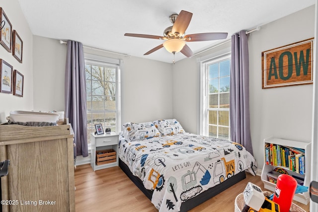 224 Murphy Ln, Bloomfield, KY 40008 - bedroom featuring light wood finished floors, a ceiling fan, and baseboards