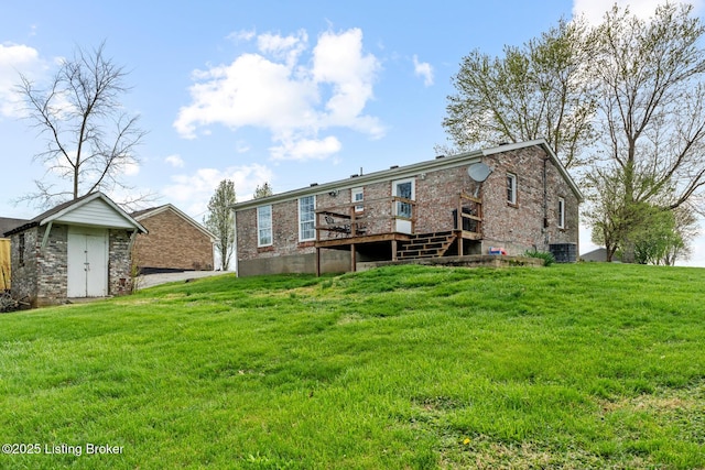 224 Murphy Ln, Bloomfield, KY 40008 - rear view of property featuring a deck, brick siding, a lawn, and a storage unit