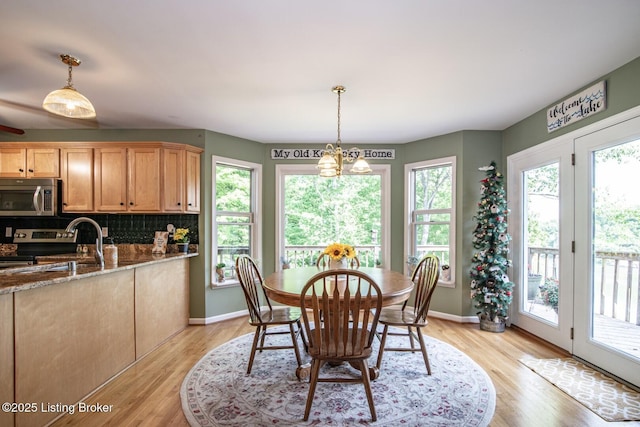 79 Ivy Ct, Brandenburg, KY 40108 - dining room with light wood-type flooring and baseboards