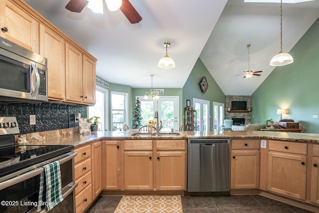 79 Ivy Ct, Brandenburg, KY 40108 - kitchen featuring appliances with stainless steel finishes, a ceiling fan, light brown cabinets, a fireplace, and a sink
