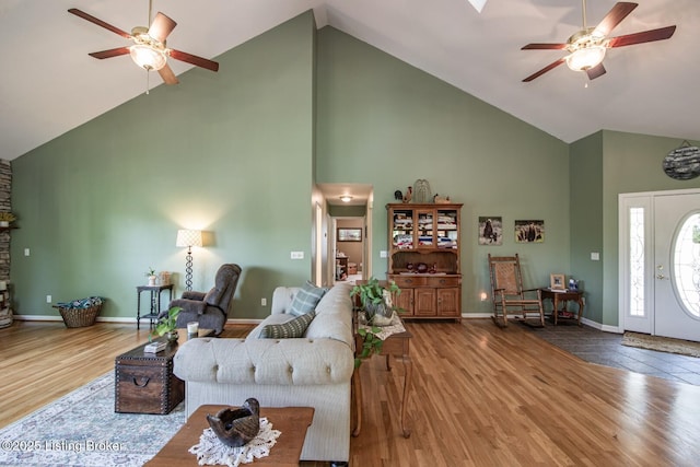 79 Ivy Ct, Brandenburg, KY 40108 - living area with high vaulted ceiling, ceiling fan, wood finished floors, and baseboards