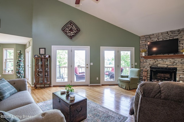 79 Ivy Ct, Brandenburg, KY 40108 - living area featuring high vaulted ceiling, a ceiling fan, wood finished floors, and a stone fireplace
