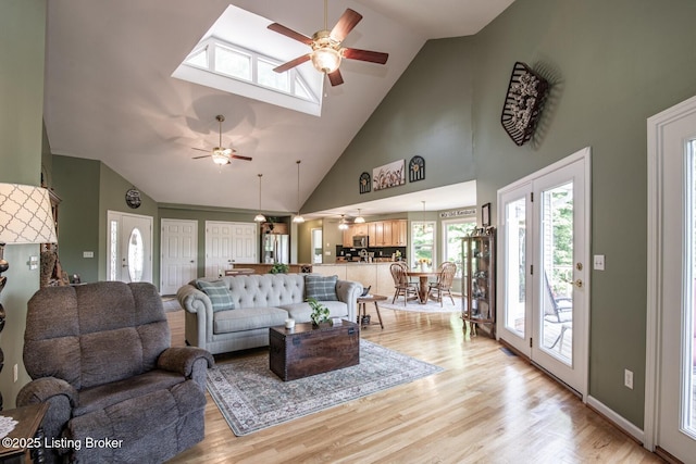 79 Ivy Ct, Brandenburg, KY 40108 - living room featuring a ceiling fan, high vaulted ceiling, and light wood-style flooring