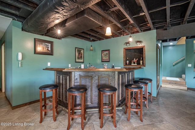 79 Ivy Ct, Brandenburg, KY 40108 - community bar area with baseboards and stone finish flooring