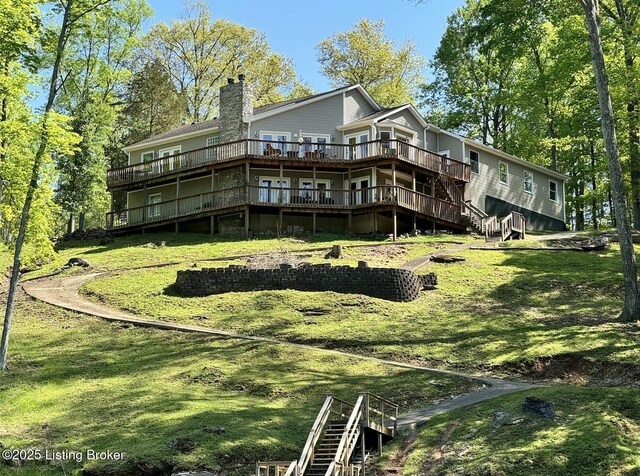 79 Ivy Ct, Brandenburg, KY 40108 - back of house featuring a wooden deck, stairway, a chimney, and a lawn