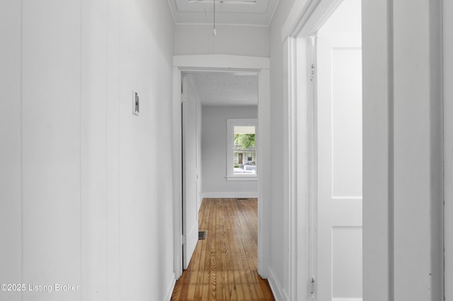 1011 Wetterau Ave, Louisville, KY 40217 - hall with attic access, wood finished floors, and baseboards