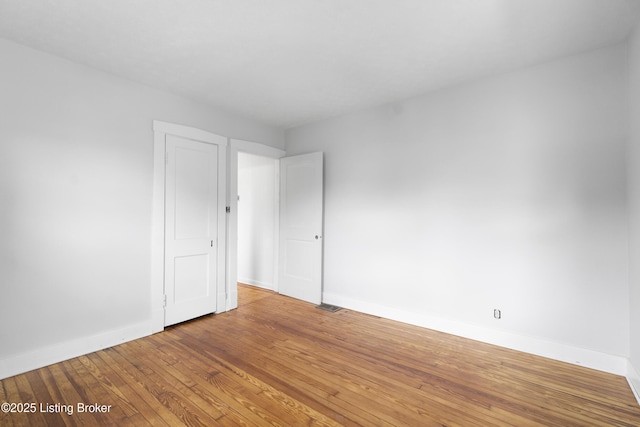 1011 Wetterau Ave, Louisville, KY 40217 - unfurnished room featuring baseboards and wood-type flooring