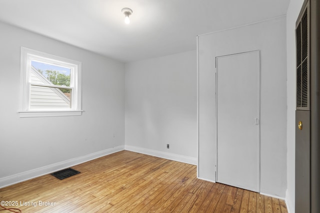 1011 Wetterau Ave, Louisville, KY 40217 - unfurnished bedroom featuring hardwood / wood-style flooring and baseboards