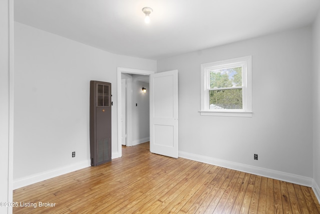 1011 Wetterau Ave, Louisville, KY 40217 - unfurnished room featuring baseboards and light wood-style floors