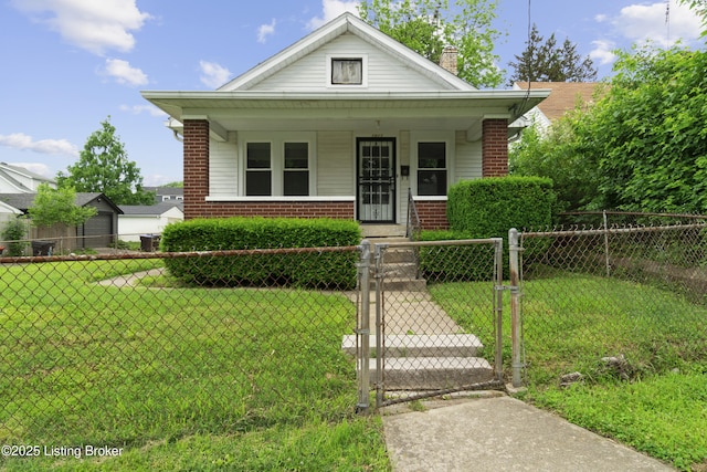 1011 Wetterau Ave, Louisville, KY 40217 - view of front of house with a gate, brick siding, a porch, and a chimney