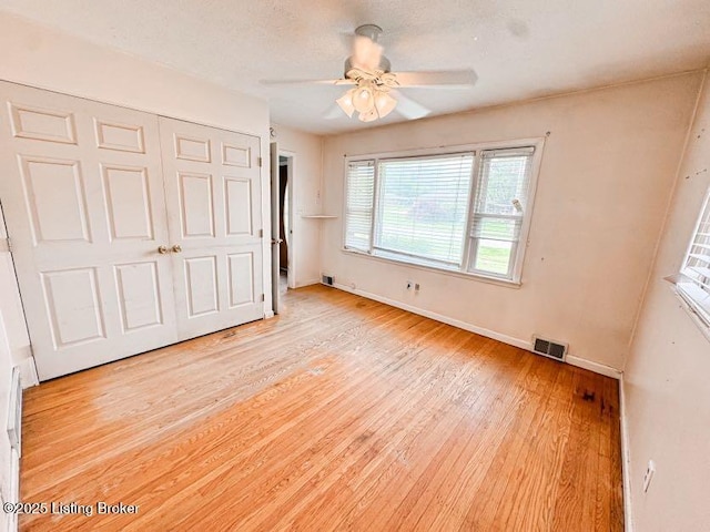 6302 Casper Dr, Louisville, KY 40258 - unfurnished bedroom with light wood-type flooring, baseboards, a closet, and a ceiling fan