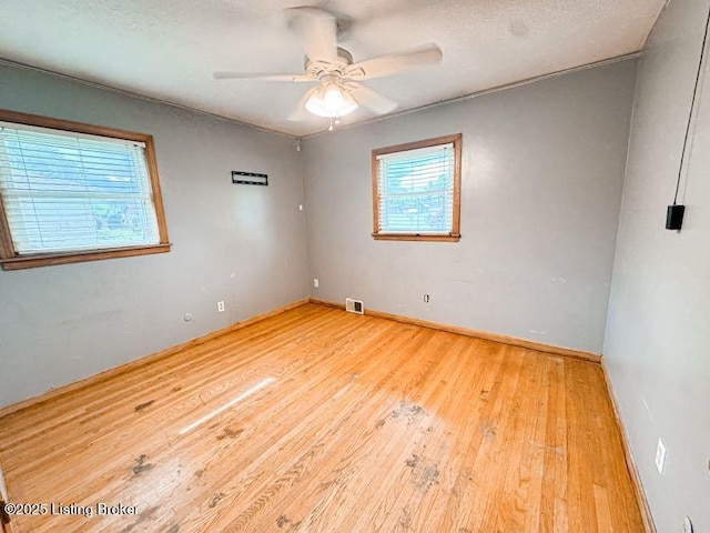 6302 Casper Dr, Louisville, KY 40258 - empty room with hardwood / wood-style floors, ceiling fan, and baseboards