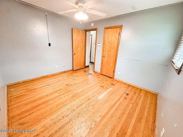 6302 Casper Dr, Louisville, KY 40258 - unfurnished bedroom featuring light wood-type flooring, baseboards, and a ceiling fan