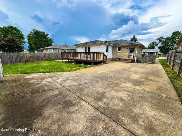 6302 Casper Dr, Louisville, KY 40258 - rear view of house with a wooden deck and a patio area