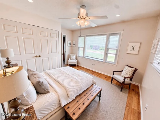 6302 Casper Dr, Louisville, KY 40258 - bedroom with a closet, light wood-style flooring, baseboards, ceiling fan, and recessed lighting