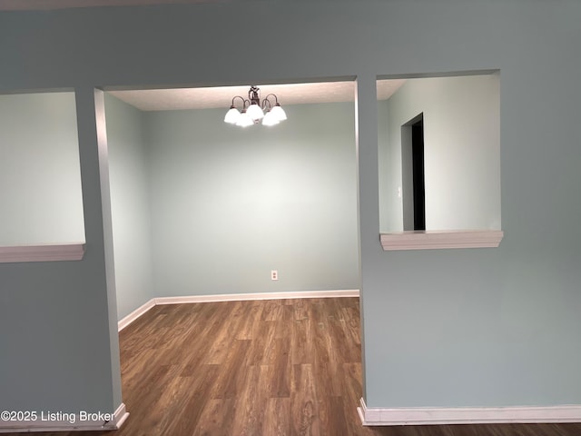 1513 La Fontenay Ct, Louisville, KY 40223 - unfurnished room featuring wood finished floors, baseboards, and a chandelier