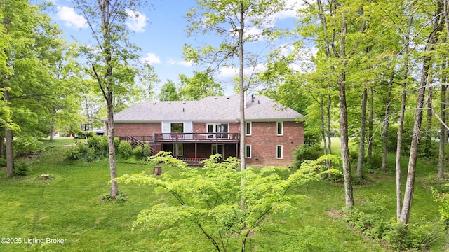 4424 Grand Cir, Crestwood, KY 40014 - back of house featuring brick siding, a wooden deck, and a lawn