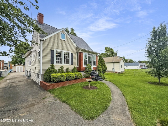 1433 Indiana Ave, Louisville, KY 40213 - view of front of home featuring a chimney, driveway, a shingled roof, and an outdoor structure