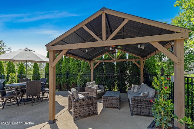 view of patio / terrace featuring a gazebo, a fenced backyard, an outdoor hangout area, and outdoor dining area
