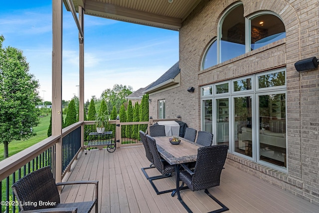 wooden deck with outdoor dining area
