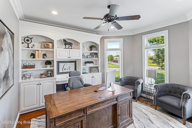 home office featuring ornamental molding, ceiling fan, light wood finished floors, recessed lighting, and built in shelves