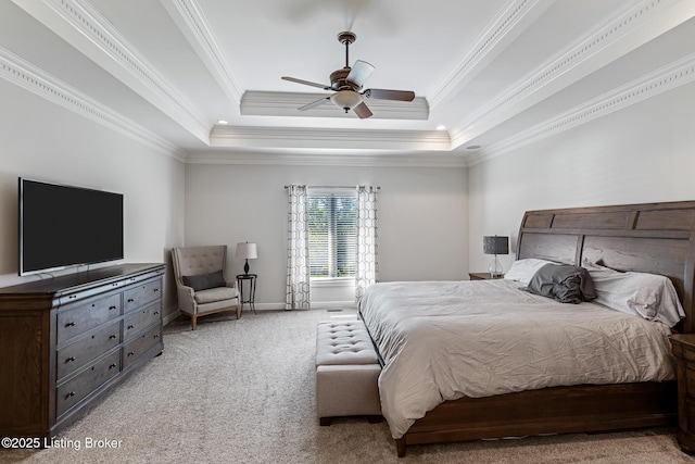 bedroom with light colored carpet, ornamental molding, a raised ceiling, baseboards, and ceiling fan