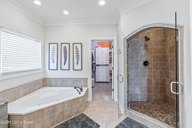 bathroom featuring a shower stall, a garden tub, tile patterned flooring, crown molding, and recessed lighting