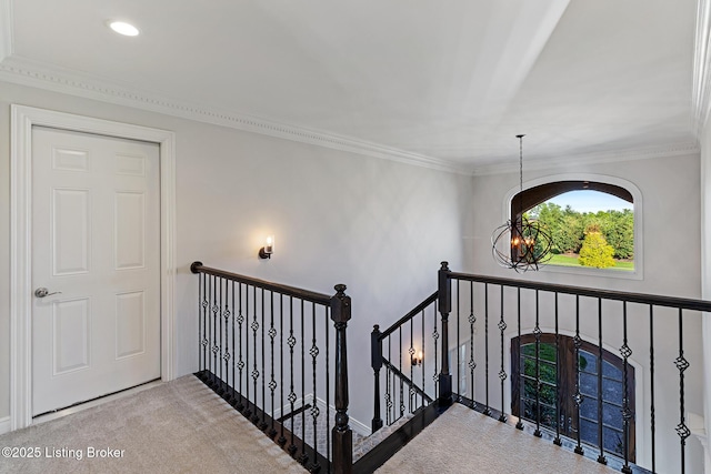 stairs with carpet, ornamental molding, and recessed lighting
